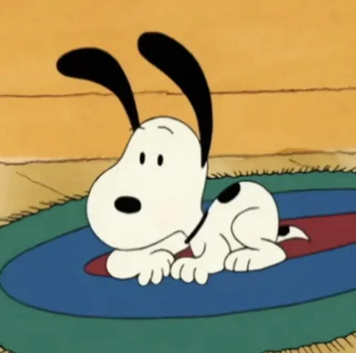 Cute puppy lying on the rug with perked ears Snoopy PFP