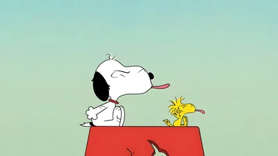 Snoopy and Woodstock sticking their tongues out on the red doghouse for PC Background