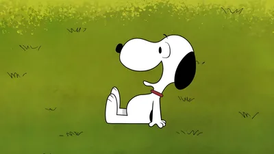 Cute Snoopy sitting happily on a lush green lawn for PC Wallpaper