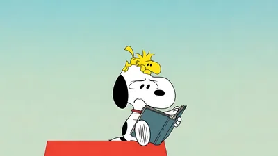 Snoopy and Woodstock reading a book on the red doghouse for PC Wallpaper