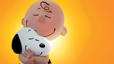 Charlie Brown warmly hugging Snoopy with love for PC Wallpaper