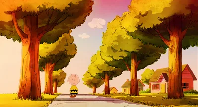 Charlie Brown standing alone on an autumn tree-lined street for PC Wallpaper