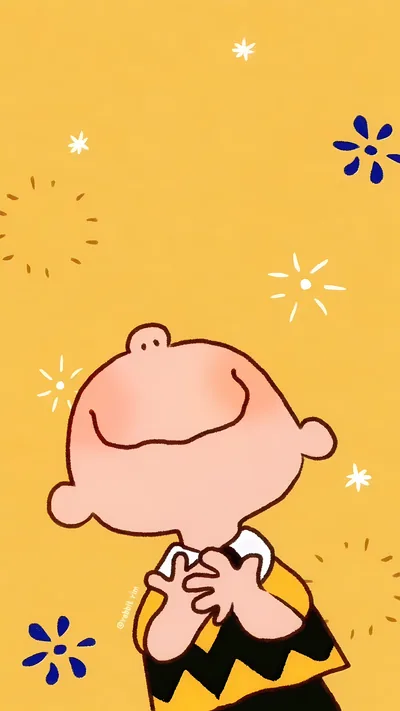 Happy Charlie Brown smiling joyfully with cute sparkles for iPhone Wallpaper