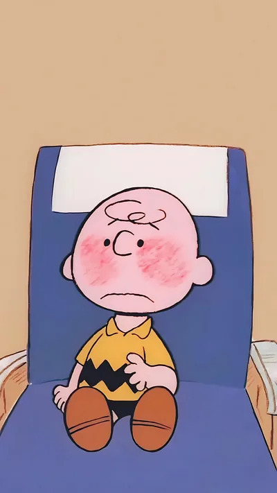 Cute Charlie Brown blushing shyly sitting in a blue seat for iPhone 4K Image